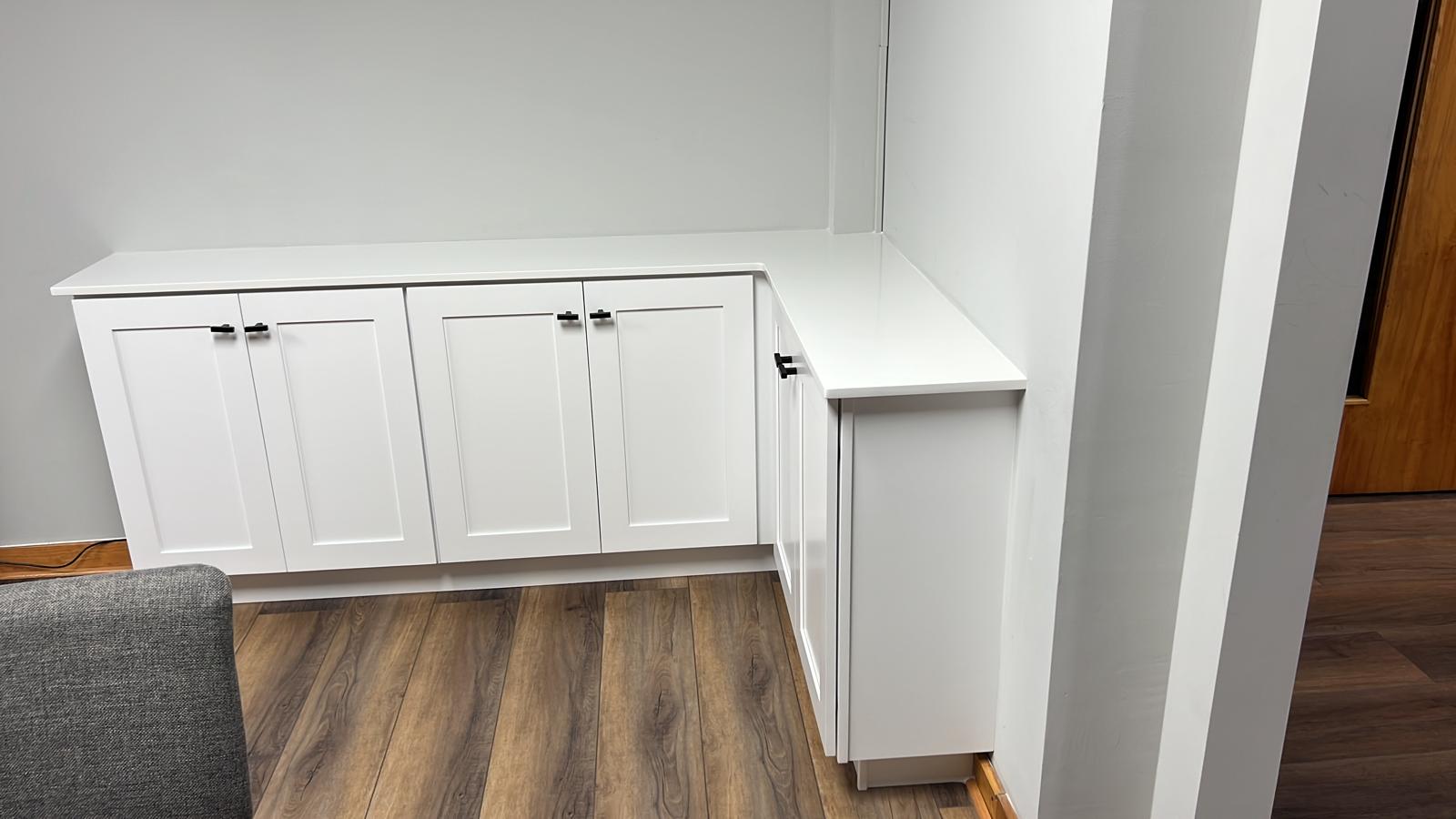 White L-shaped countertop on shaker cabinets